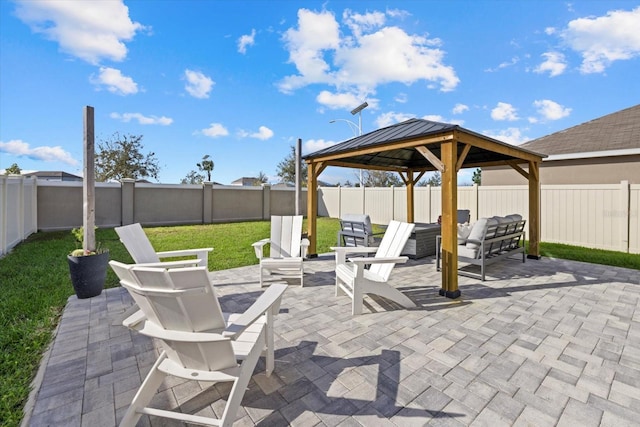 view of patio / terrace featuring a fenced backyard and a gazebo