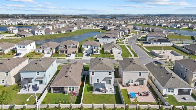 bird's eye view with a residential view and a water view