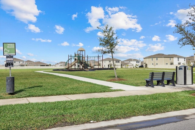 community play area with a yard and a residential view