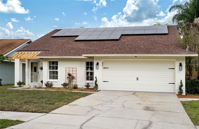 view of front of home with roof with shingles, stucco siding, a front yard, a garage, and driveway