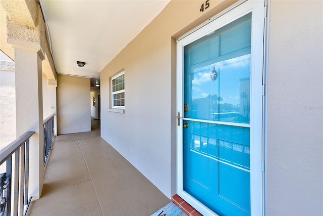 doorway to property with stucco siding