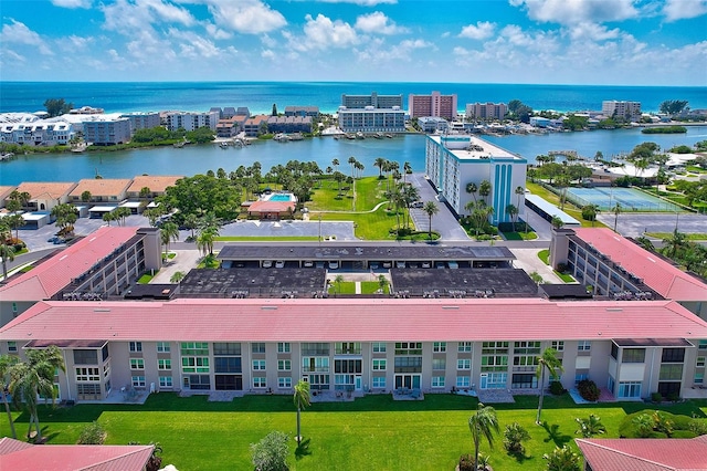 birds eye view of property with a water view