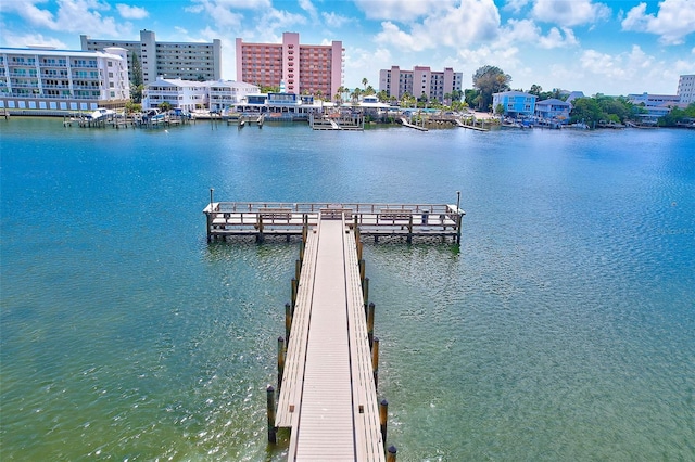 dock area featuring a water view and a city view