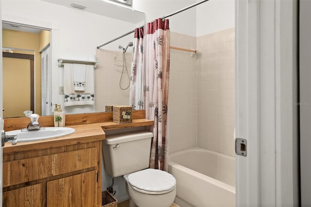 full bath featuring visible vents, shower / bathtub combination with curtain, vanity, and toilet