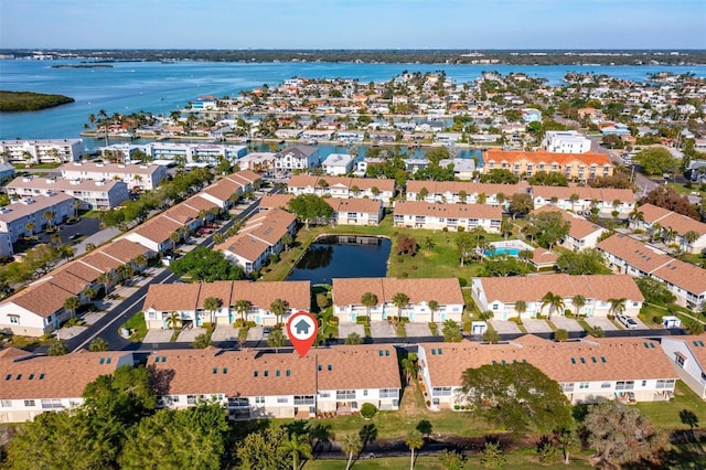 bird's eye view with a residential view and a water view