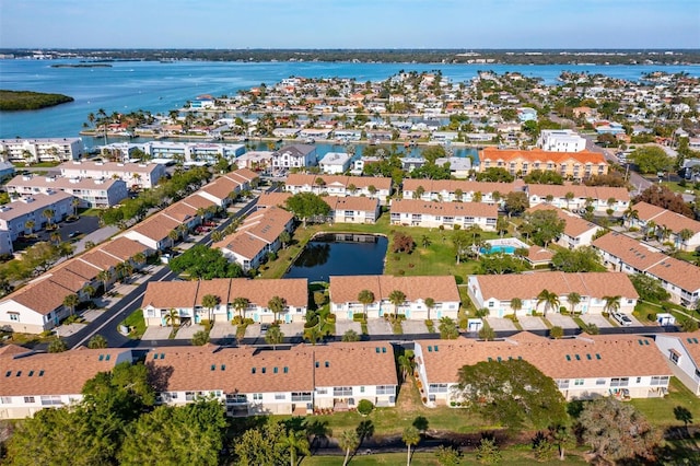 bird's eye view featuring a residential view and a water view