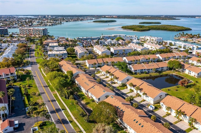 drone / aerial view with a residential view and a water view