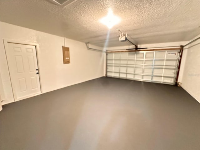 garage featuring a garage door opener and electric panel