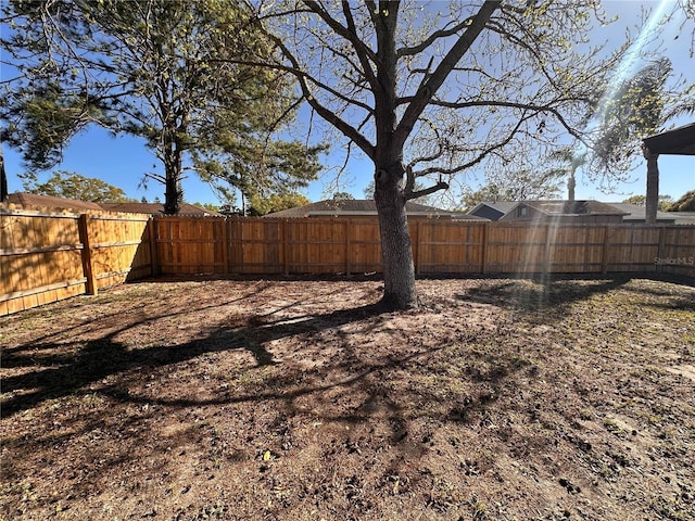 view of yard with a fenced backyard