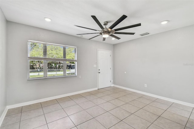 empty room with a ceiling fan, recessed lighting, visible vents, and baseboards