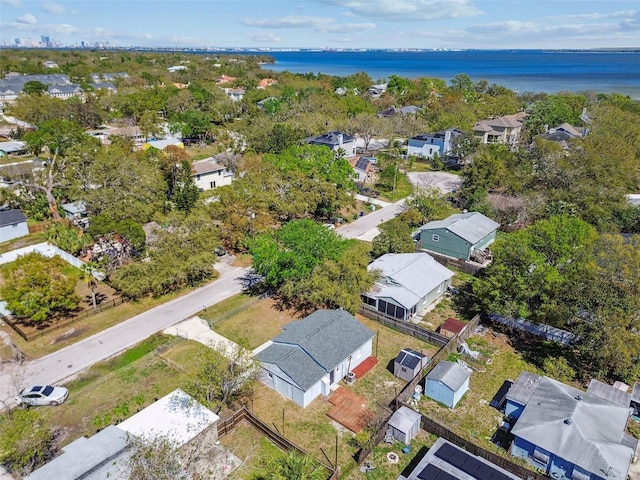 drone / aerial view featuring a water view and a residential view