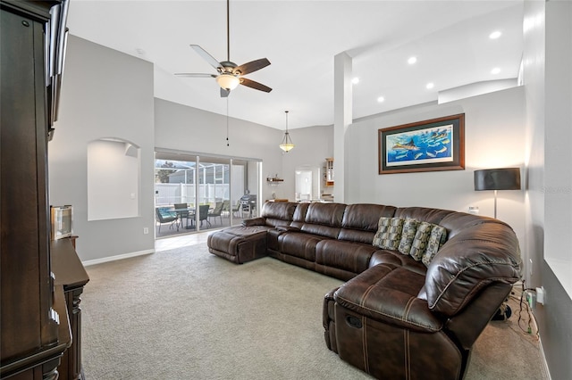 carpeted living room with ceiling fan, high vaulted ceiling, baseboards, and recessed lighting