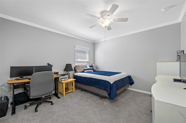 carpeted bedroom featuring ceiling fan, baseboards, and crown molding