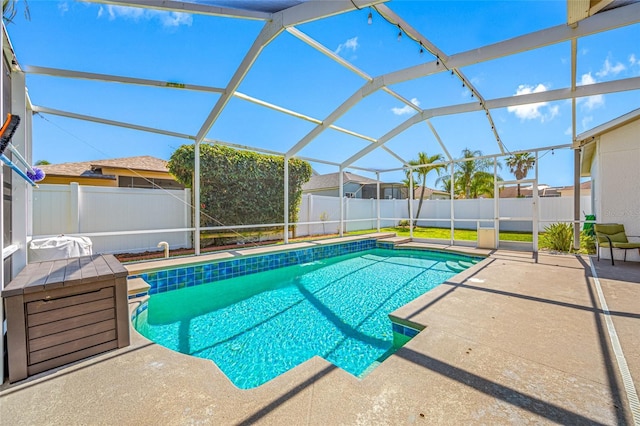 view of pool featuring a lanai, a patio area, a fenced backyard, and a fenced in pool