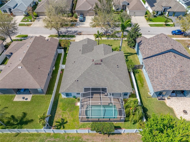 birds eye view of property with a residential view