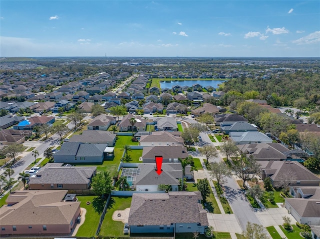 aerial view featuring a residential view and a water view