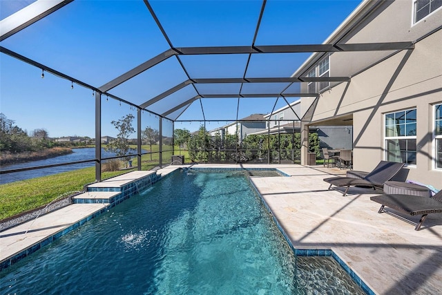 pool with a patio area, a lanai, and a water view