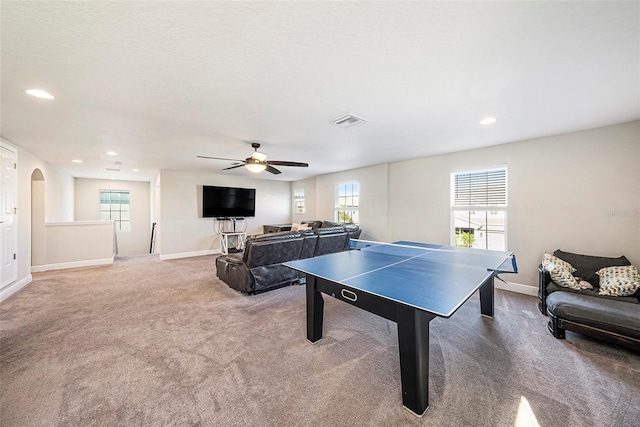 game room with a wealth of natural light, carpet, visible vents, and baseboards