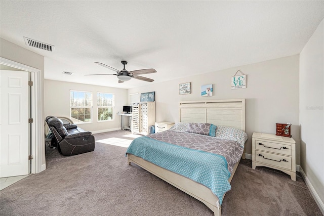 bedroom with carpet floors, baseboards, and visible vents