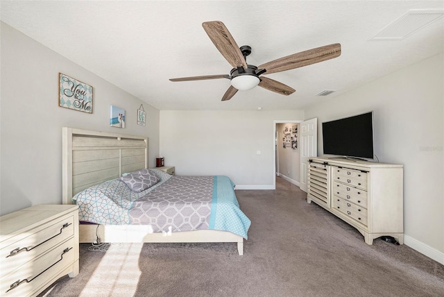 carpeted bedroom with baseboards, visible vents, and a ceiling fan