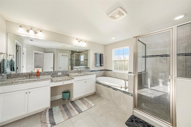 bathroom with vanity, a shower stall, a bath, and tile patterned floors