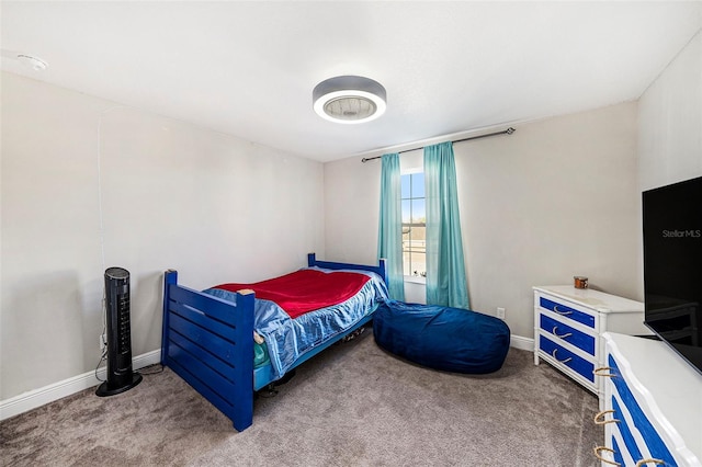 bedroom featuring carpet flooring and baseboards