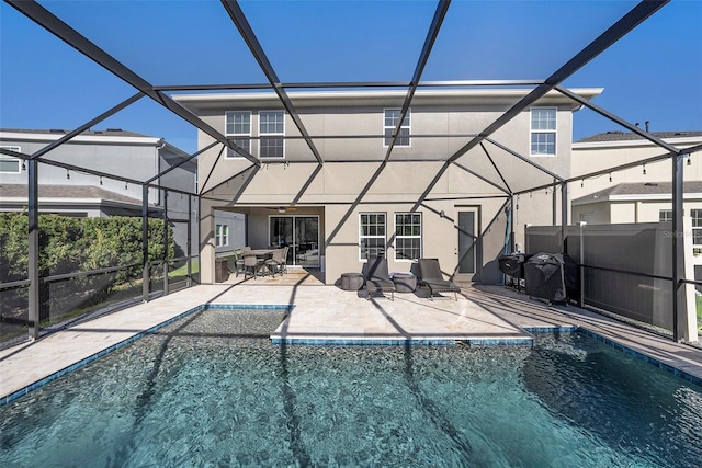 outdoor pool featuring a lanai and a patio