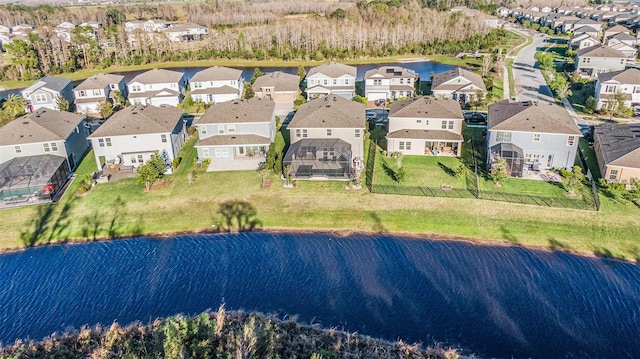 bird's eye view featuring a residential view and a water view