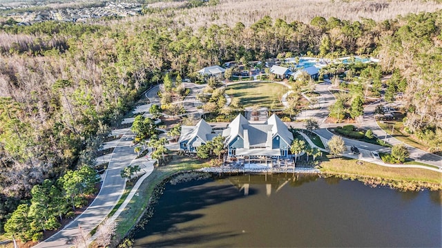 aerial view with a water view and a forest view