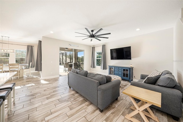 4607 Ballantrae Blvd, Land O Lakes, FL 34638 - living area featuring a ceiling fan, plenty of natural light, recessed lighting, wood tiled floors, and baseboards
