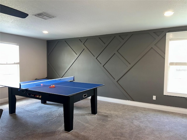 4607 Ballantrae Blvd, Land O Lakes, FL 34638 - rec room with carpet floors, a decorative wall, recessed lighting, and a textured ceiling