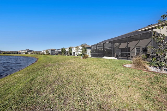4607 Ballantrae Blvd, Land O Lakes, FL 34638 - view of grassy yard with a water view, a residential view, and glass enclosure
