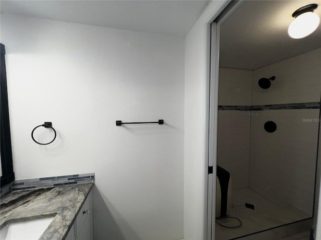 bathroom featuring a stall shower and vanity