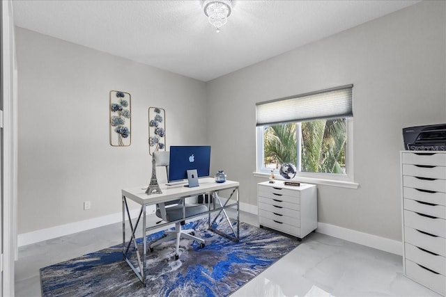 office with baseboards and a textured ceiling