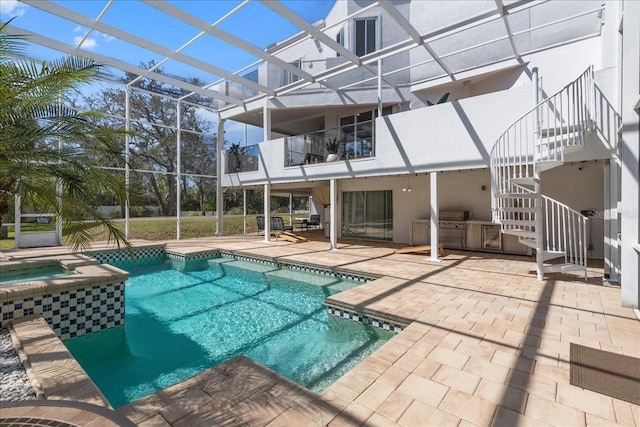 view of pool featuring a pool with connected hot tub, glass enclosure, grilling area, stairs, and a patio area