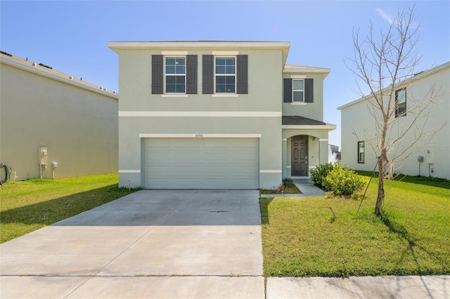 traditional-style house featuring a garage, concrete driveway, a front lawn, and stucco siding