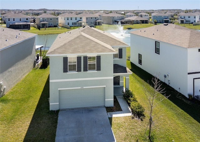 view of front of house featuring concrete driveway, a residential view, and stucco siding