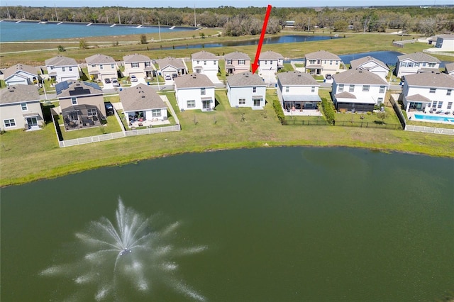 bird's eye view with a water view and a residential view