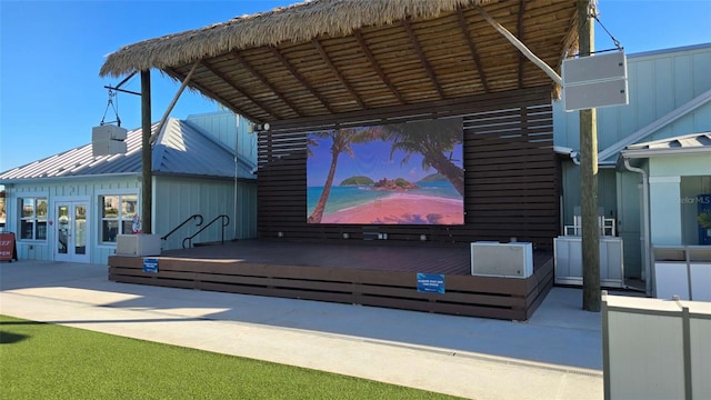 home theater room featuring high vaulted ceiling