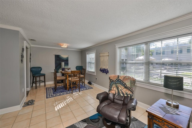 dining room with ornamental molding, a healthy amount of sunlight, visible vents, and light tile patterned floors