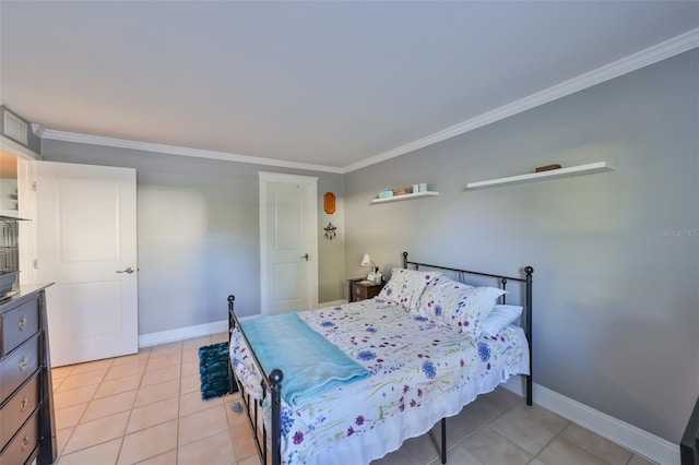 bedroom featuring ornamental molding, baseboards, and light tile patterned floors