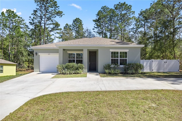 single story home featuring stucco siding, an attached garage, concrete driveway, and a front lawn