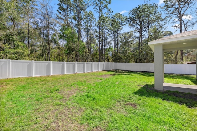 view of yard with a fenced backyard