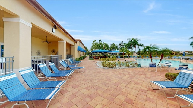 view of patio / terrace featuring ceiling fan and a community pool