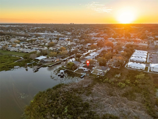 birds eye view of property with a water view and a residential view