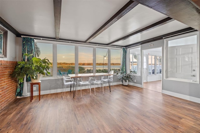 sunroom with beamed ceiling