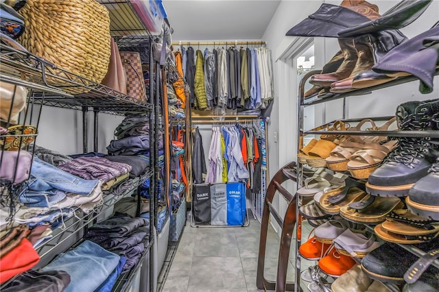 walk in closet featuring tile patterned flooring