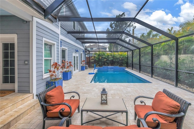 outdoor pool with glass enclosure, outdoor lounge area, a patio area, and french doors