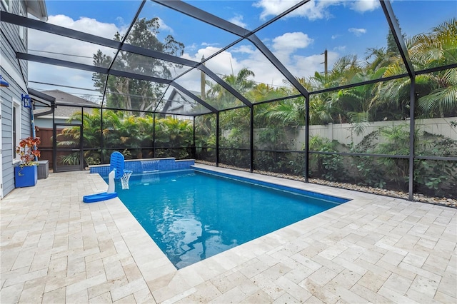 view of swimming pool with a patio area, a lanai, and a fenced in pool