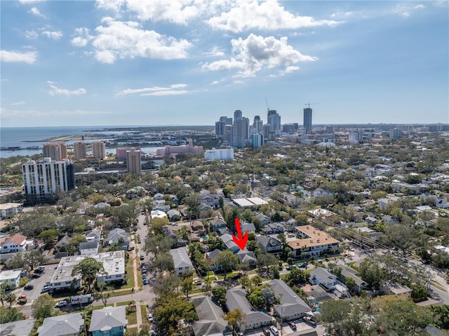 birds eye view of property featuring a water view and a view of city